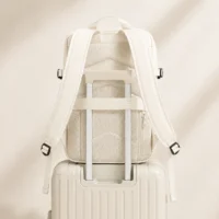 Sac à dos de voyage blanc cassé avec rangements intérieurs pour vêtements et accessoires