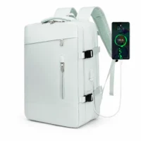 Sac à dos de voyage extensible vert clair avec port USB externe pour recharger un téléphone
